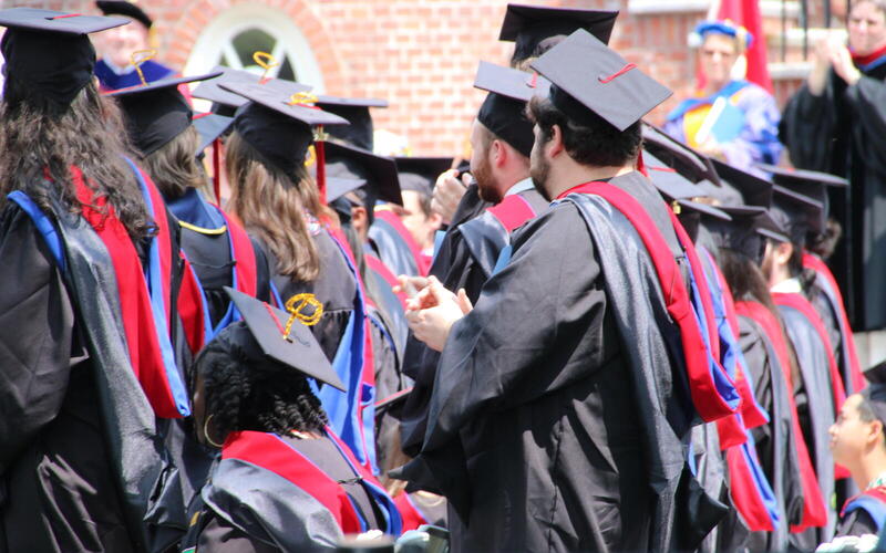 Graduates clapping