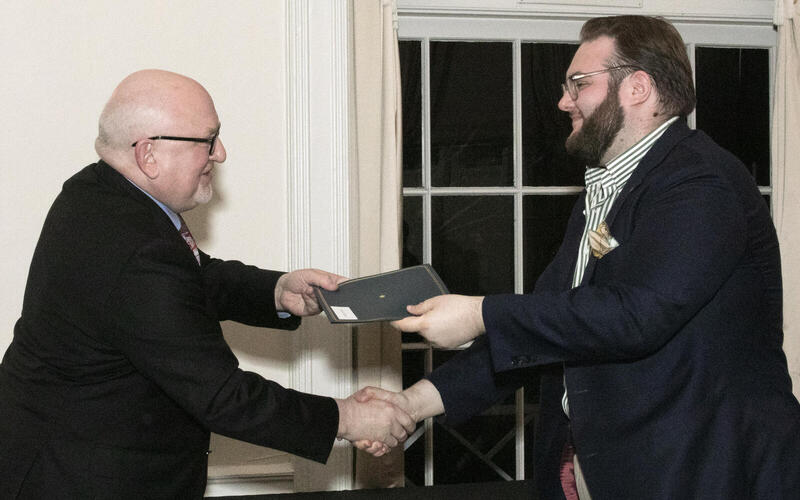 Martin Jean giving a diploma to a student