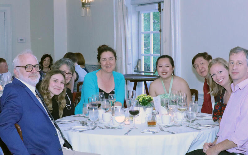 Graduates sitting aat a table