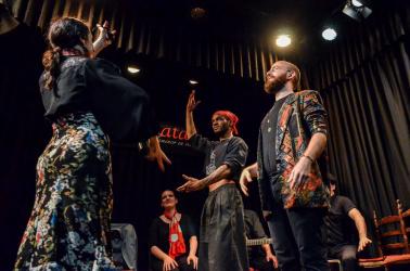 Students Dustin Gavin and Haitham Haidar dance “sevillanas” with a flamenco dancer