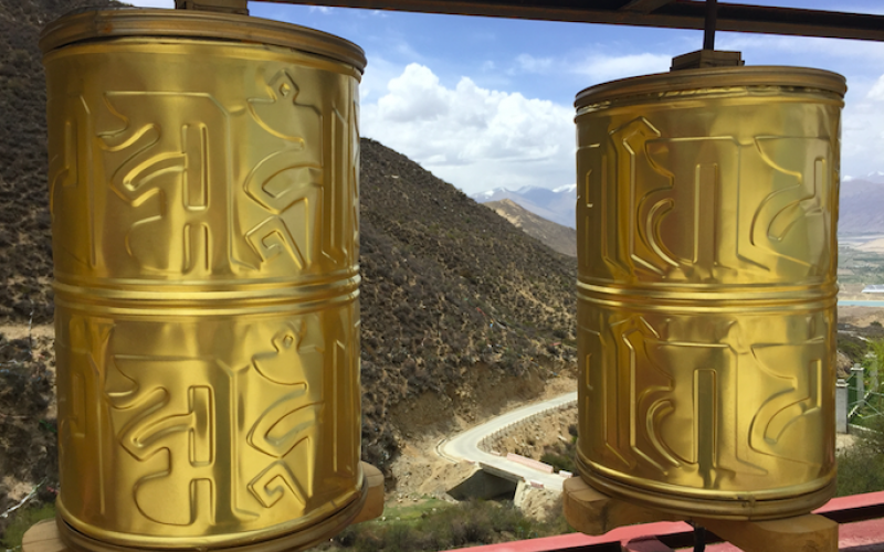 Tibetan Buddhist prayer wheels, which are turned clockwise by worshippers as they walk by