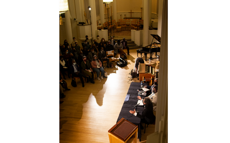 Aerial shot of Cornel West and panel speaking