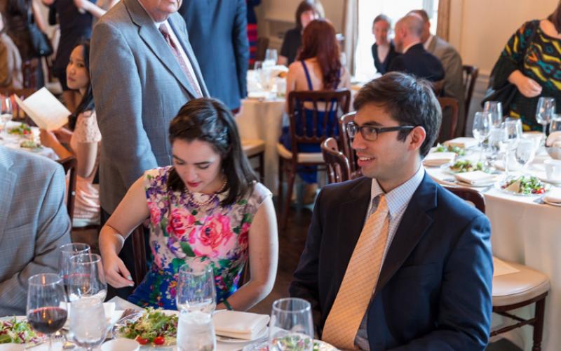 Graduates sitting at a table