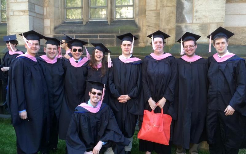 Graduates in a group with caps and gowns on