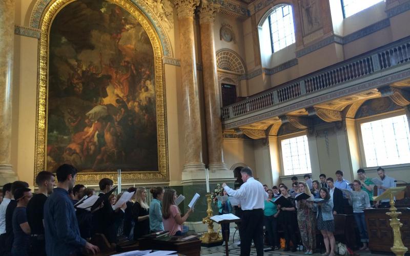 David Hill rehearsing Schola members for their joint Evensong at the Old Royal Naval College, Greenwich