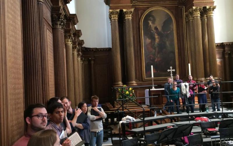 Schola members rehearsing at Trinity College Chapel, Cambridge