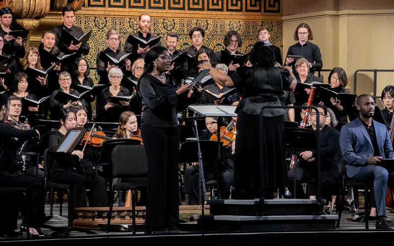 Dr. Felicia Barber conducting with soloist