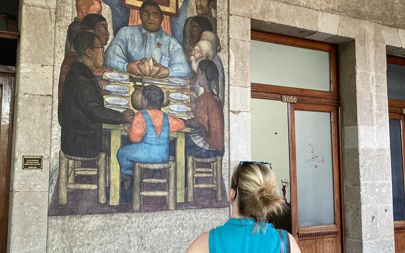 Chris Veillon ’23, viewing a mural by Diego Rivera, Secretariat of Public Education Main Headquarters, Mexico City