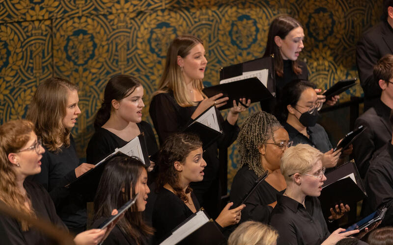 Sopranos and altos performing in Woolsey Hall