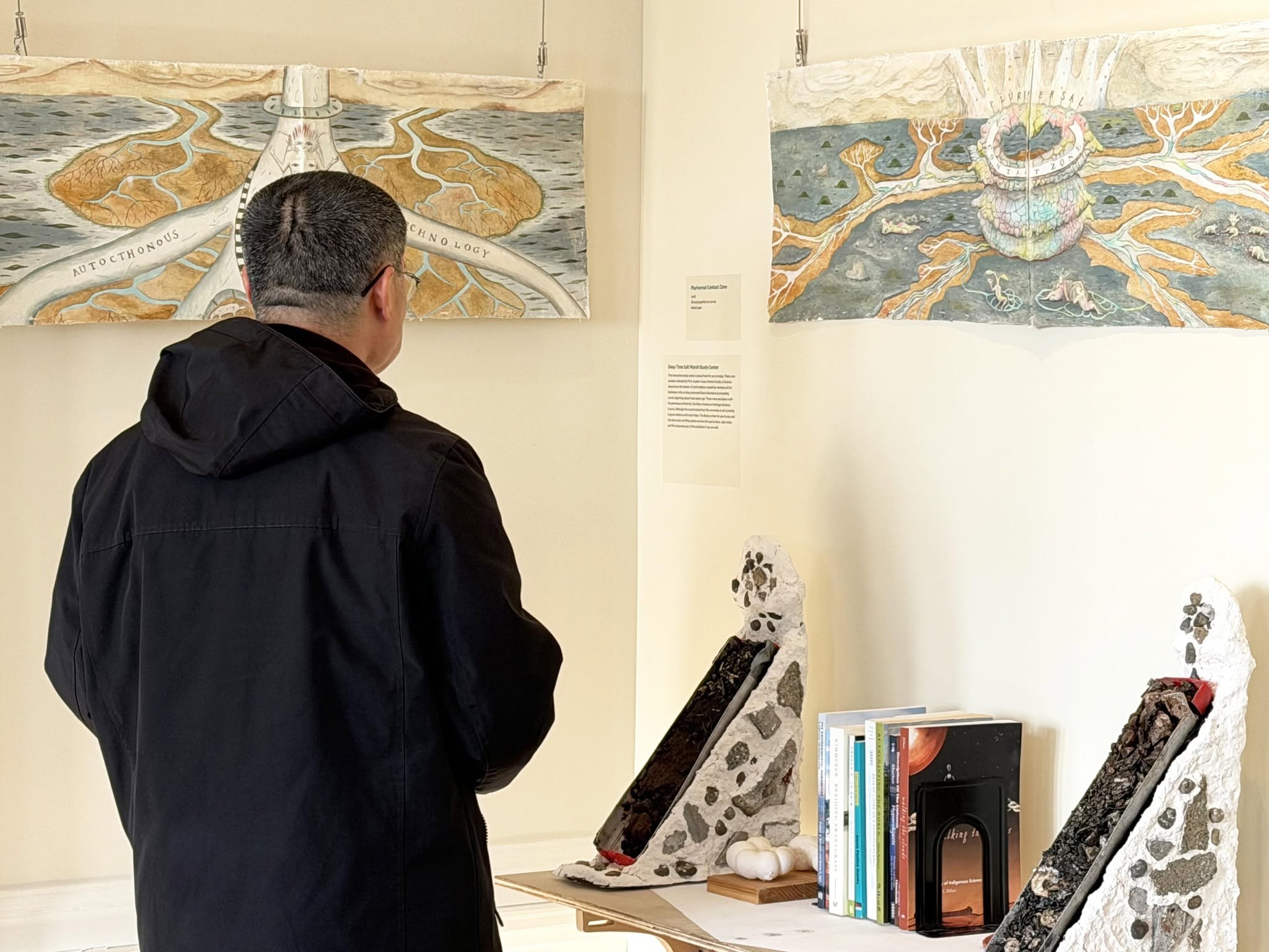Patron viewing artworks
