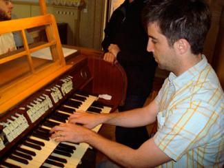 Student playing the organ
