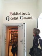 ISM administrator Kristen Forman pauses to admire the entrance to Nicholas of Cusa's library