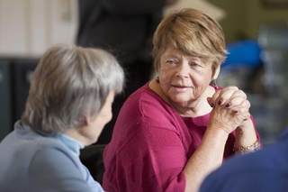 Two women talking during the program 