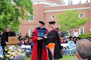 Graduate receiving an award