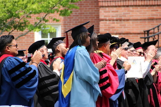 Graduates clapping