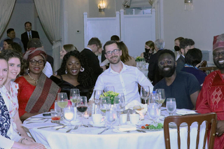 Graduate students around a table