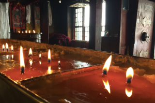 Candles burning in a temple in China