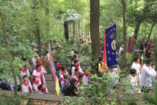 Catholic pilgrims processing up Sheshan Mountain