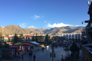 Entrance to the Barkhor and mountains surrounding Lhasa