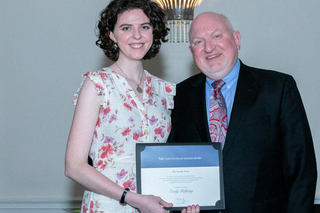 Graduate accepting an award