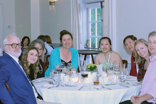 Graduates sitting aat a table