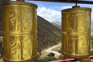 Tibetan Buddhist prayer wheels, which are turned clockwise by worshippers as they walk by