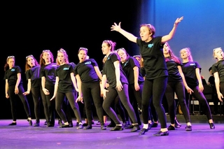 Young students in a theater performance