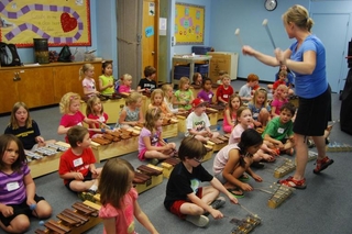 Kindergarten class playing with musical instruments