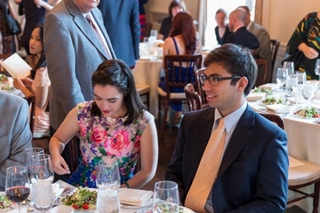 Graduates sitting at a table