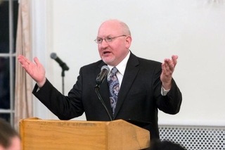 Martin Jean speaking to the graduating class