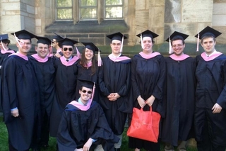 Graduates in a group with caps and gowns on