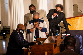 Derrick Jackson plays organ for the captivated panelists