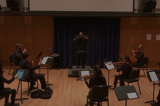 James Davis Jr., conducting