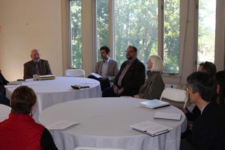 Staff sitting a tables