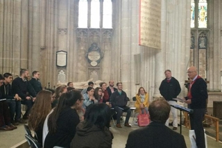 Schola members learn about the historic Winchester Bible