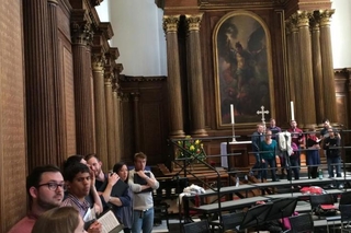 Schola members rehearsing at Trinity College Chapel, Cambridge