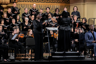 Dr. Felicia Barber conducting with soloist