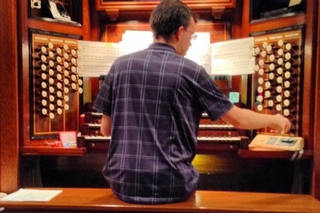 Trying out the organ at St. Ignatius (Emilie Coakley)