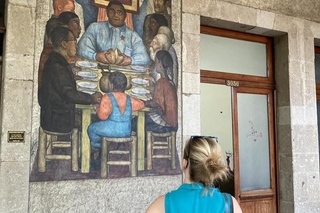 Chris Veillon ’23, viewing a mural by Diego Rivera, Secretariat of Public Education Main Headquarters, Mexico City