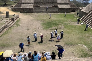 Gathering for a group photo on the steps of Monte Albán