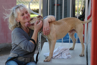Laura Hobgood-Oster hugging a dog