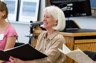 Marguerite L. Brooks smiles from the alto section