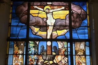 Stained glass image of Jesus on the cross