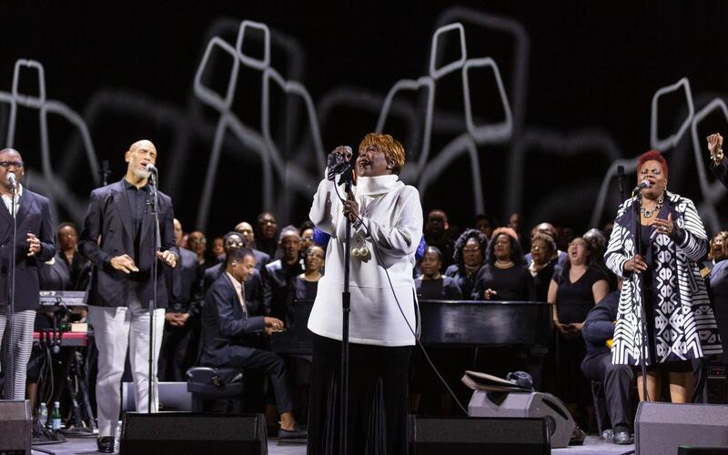 Lady Tramaine Hawkins singing with piano and choir