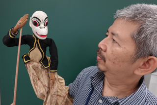 Rod Puppet with a puppeteer